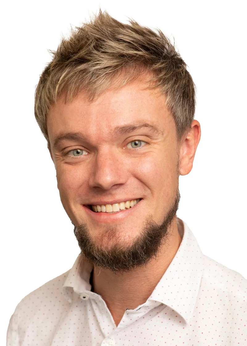 Austin Kimble smiling in his professional portrait